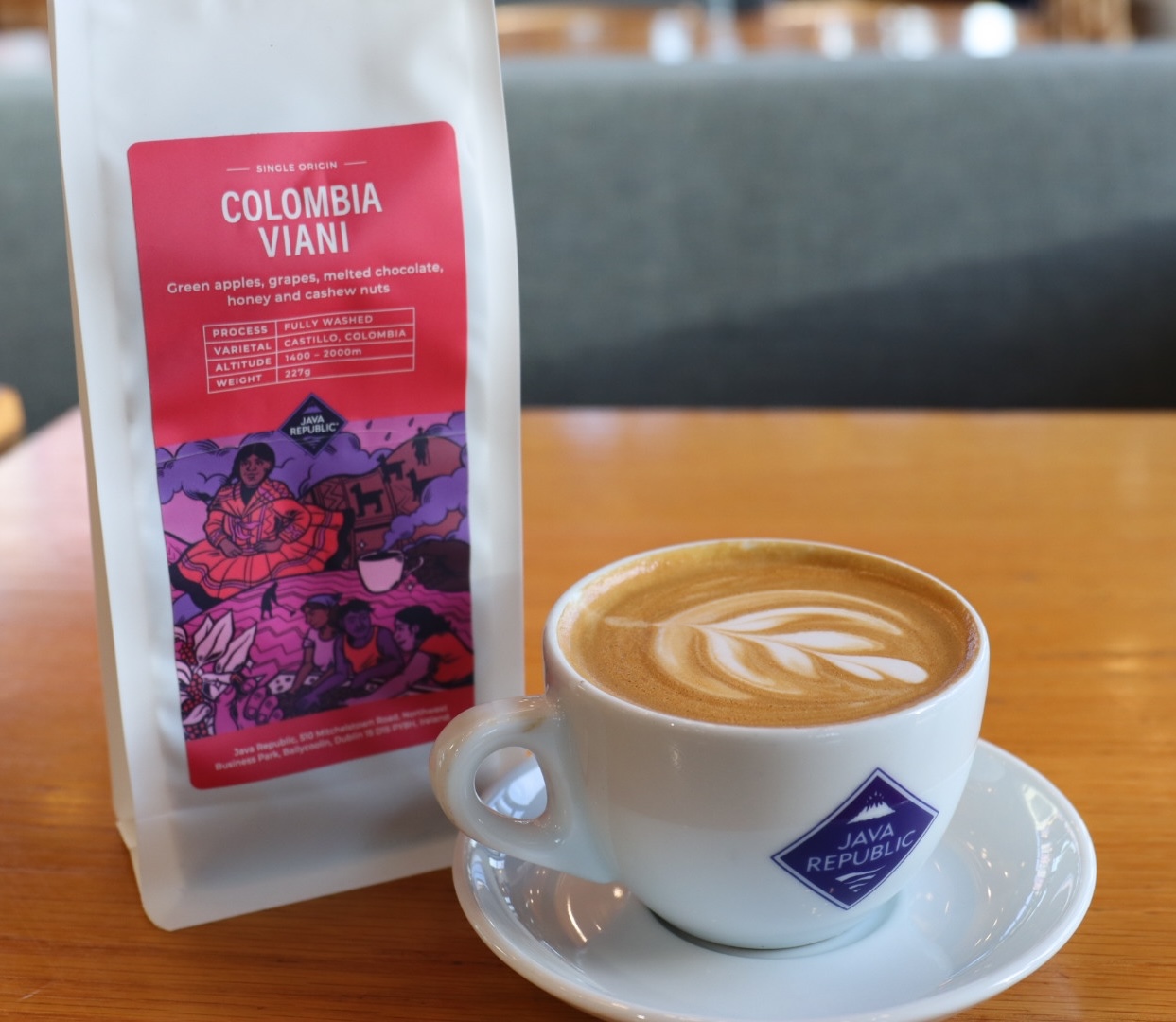 Bag of Colombia Viani coffee beside a Java Republic cup of coffee