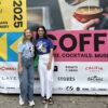Laura McKitterick and Anushka Bedi standing in front of the London Coffee Festival 2025 sign